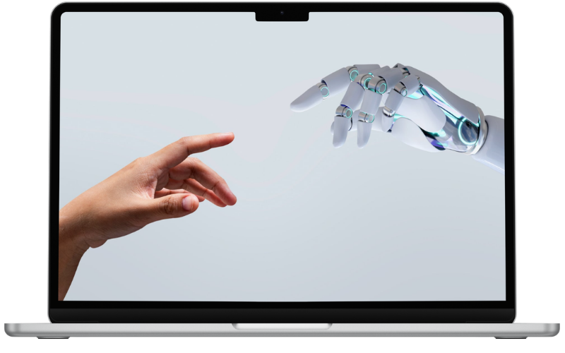 Notebook mostrando una mano humana y una mano robótica conectándose — diseño web con inteligencia artificial de Vende Digital